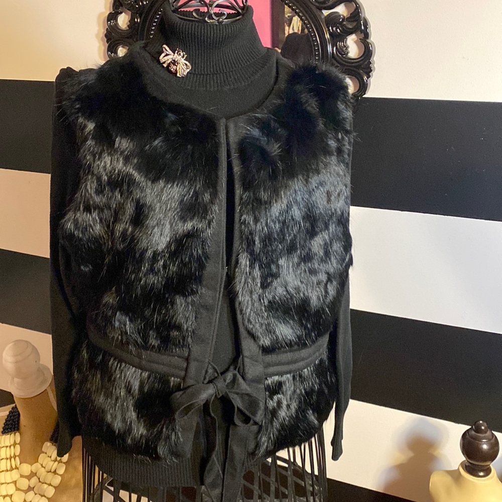 Black fur vest.